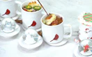 mugs with food inside next to a lid with a snow globe 