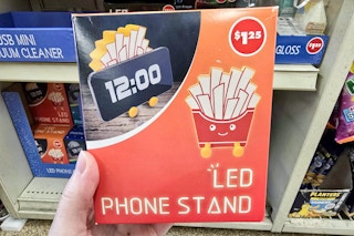 person holding a french fry led phone stand 