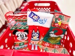 3 disney holiday stockings sitting in a target cart