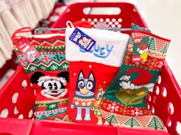 3 disney holiday stockings sitting in a target cart