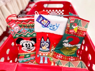 3 disney holiday stockings sitting in a target cart