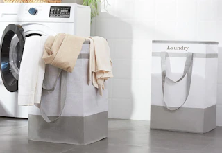 two laundry baskets on a floor