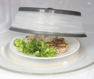 a microwave cover on a plate of food