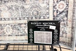 dollar tree badgley mischka rug draped over cart