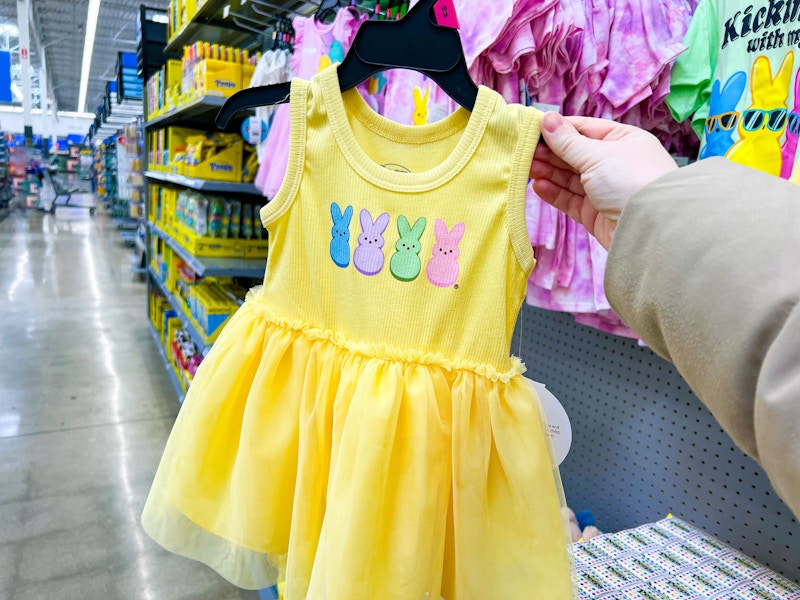 hand holding peeps toddler tutu dress in walmart aisle