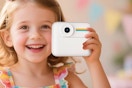 Little girl holding the OTJ Kids Camera Instant Print
