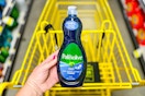 hand holding a bottle of palmolive dish soap at dollar general
