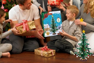 Wooden Tree Advent Calendar being held by child