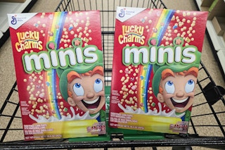 2 boxes of lucky charms minis cereal in a cart