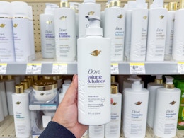 hand holding dove shampoo in walgreens