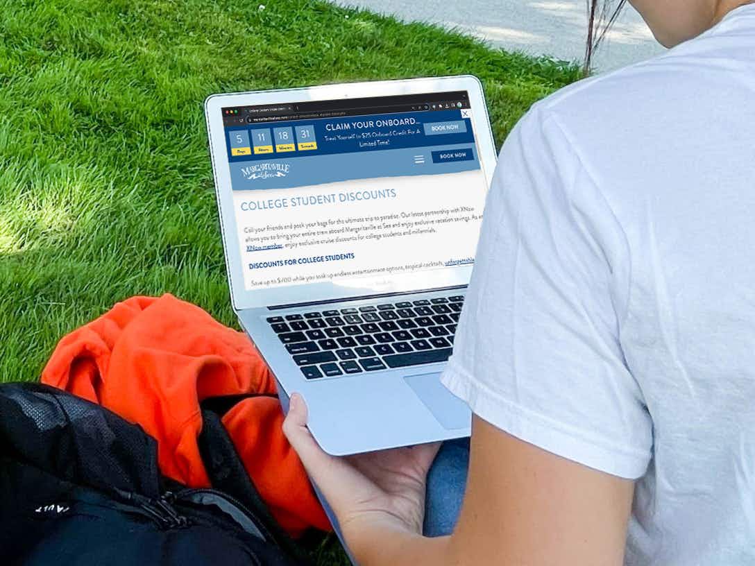 a college student looking at cruise discounts on the Margaritaville at Sea cruise website