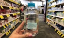 a hand holding a bottle of micellar water