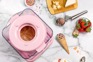 a nostalgia ice cream maker on a table