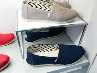 Red, blue, and grey toms shoes display