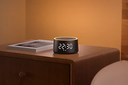 a dreamegg machine on a nightstand