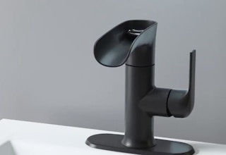 a black faucet on a sink