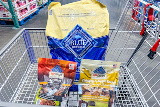 blue buffalo dog food and dog treats in a costco shopping cart