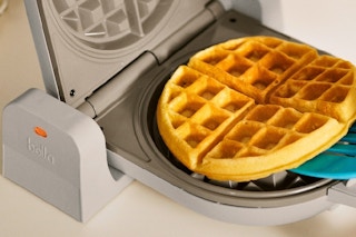 a bella waffle maker making a waffle