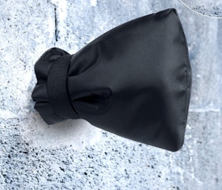 a black faucet cover on a outdoor faucet