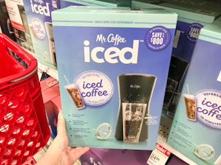 hand holding a Mr. Coffee iced coffee maker box