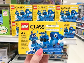 hand holding small LEGO box on clearance at Target