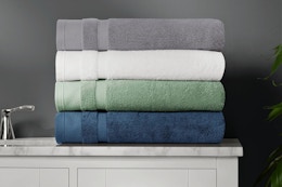 Lifestyle image of 4 towels folded up on bathroom counter