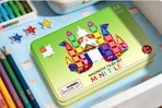 box of magnetic building blocks on desk