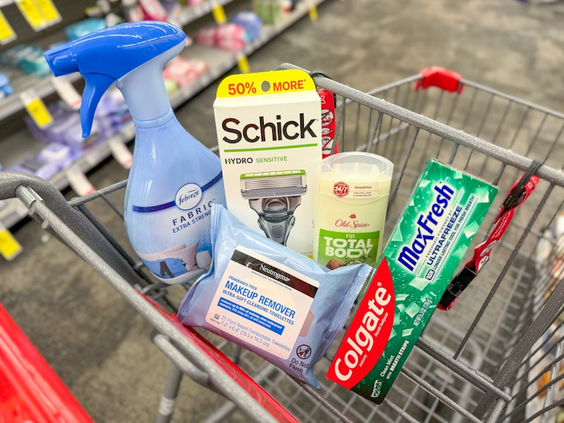 febreze spray, schick razor, neutrogena wipes, colgate toothpaste, and old spice deodorant in a cart