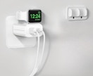 an Apple watch on a charger plugged into an outlet