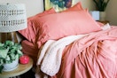 linens and hutch sheets and blanket in a bedroom 