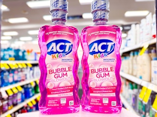 2 bottles of act kids mouthwash on a shelf