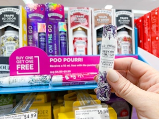 poo pourri items being held and on shelf