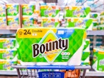 Bounty Paper Towels in Walmart shopping cart in front of the paper towel aisle