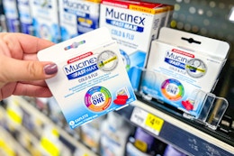 hand holding mucinex at dollar general