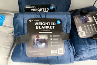 Altavida 12-Pound Ultra Plush Faux Mink Weighted Blanket on shelf