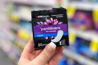 hand holding a pack of cvs health pantiliners