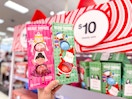 hand holding 2 da bomb gift sets in at target