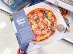 hand holding nordic ware pizza baking set on target shelf