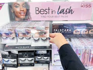 kiss lashes being held