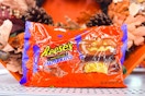 bag of reese's pumpkins in front of a fall wreath