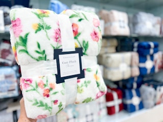 someone holding a plush throw