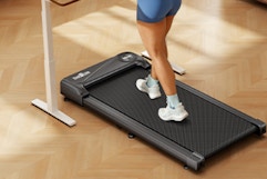 person walking on under-desk treadmiill