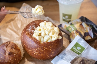 A bread bowl filled with mac and cheese