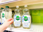 grabbing a bottle of seventh generation dish soap off a target shelf