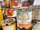 a fall scented candle on a display with other fall scented candles