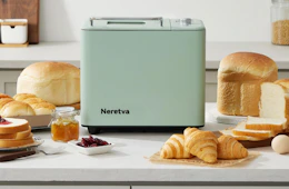 a mint bread maker on a counter with different breads