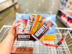 hand holding a hersheys variety pack
