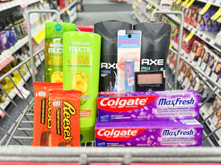 reeses, toothpaste, shampoo, body wash, and makeup in a cart