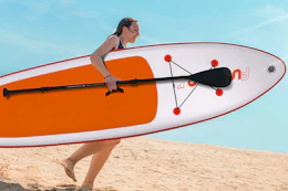 woman running with paddleboard
