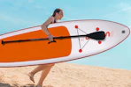 woman running with paddleboard